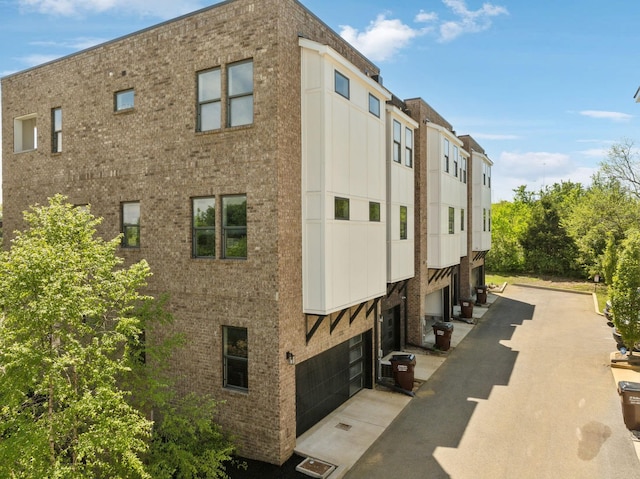 view of building exterior featuring an attached garage
