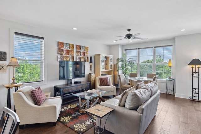 living area with recessed lighting, a ceiling fan, hardwood / wood-style floors, and baseboards