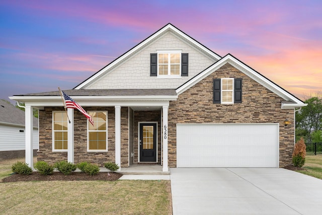 6380 Japonica Ln, White House, TN 37188 - view of front of property with covered porch, driveway, a lawn, and stone siding