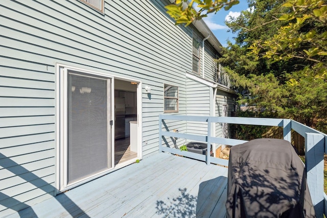 wooden deck with area for grilling