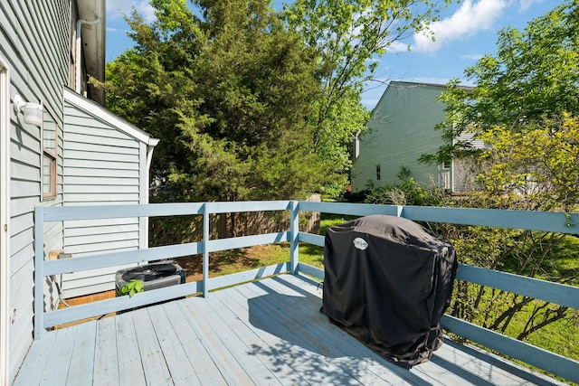 wooden terrace with area for grilling