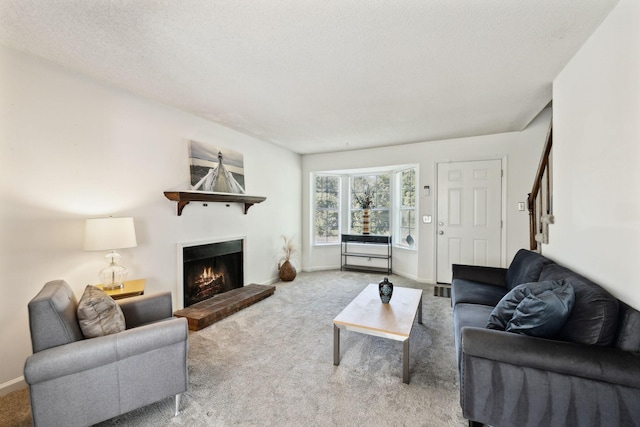 carpeted living room with baseboards and a fireplace