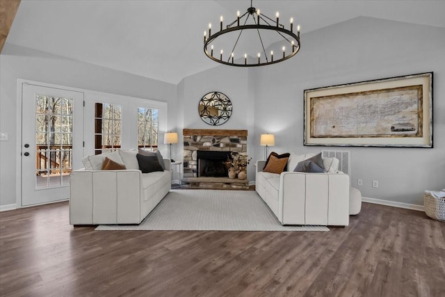 7327 Hunting Camp Rd, Fairview, TN 37062 - living room featuring vaulted ceiling, an inviting chandelier, and wood finished floors
