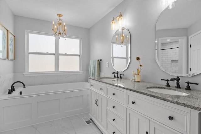 7327 Hunting Camp Rd, Fairview, TN 37062 - full bathroom with an inviting chandelier, a bath, marble finish floor, and a sink