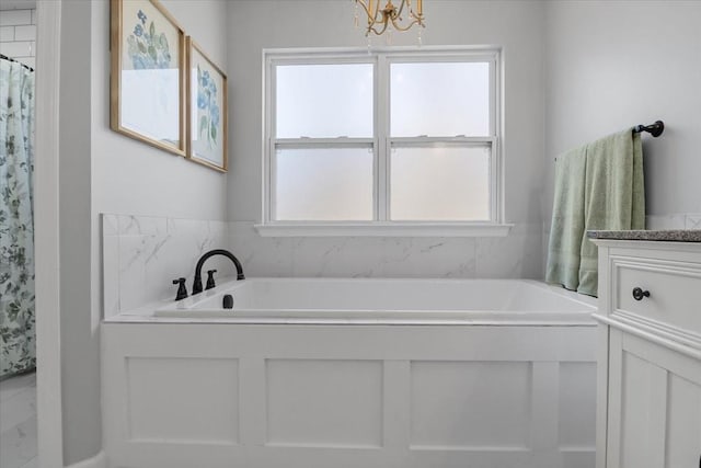 7327 Hunting Camp Rd, Fairview, TN 37062 - full bathroom featuring vanity, a chandelier, and a bath