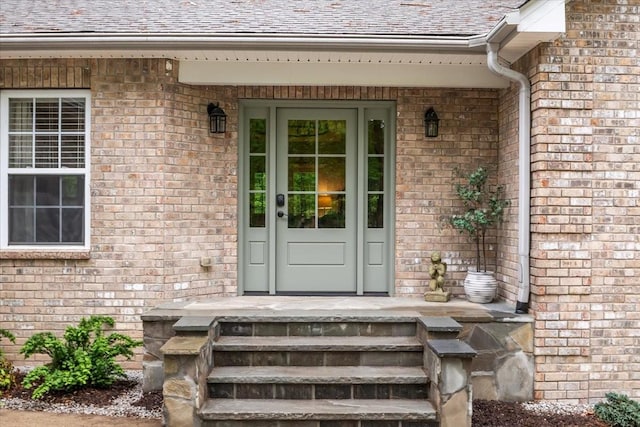 7327 Hunting Camp Rd, Fairview, TN 37062 - doorway to property featuring a shingled roof and brick siding