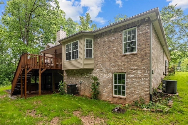 7327 Hunting Camp Rd, Fairview, TN 37062 - rear view of house with stairway, a deck, cooling unit, and a chimney