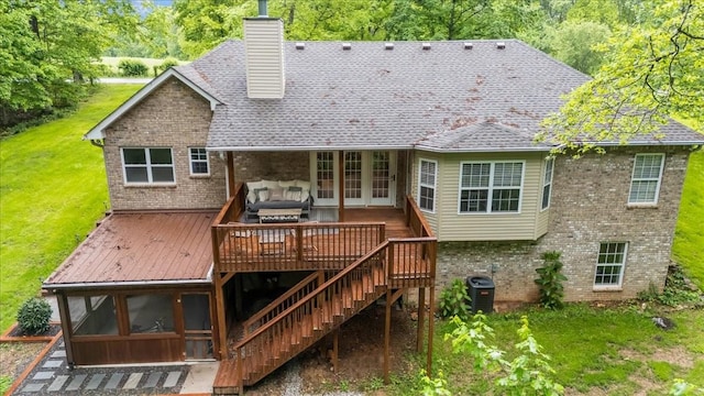 7327 Hunting Camp Rd, Fairview, TN 37062 - back of property with a yard, a wooden deck, a chimney, and brick siding