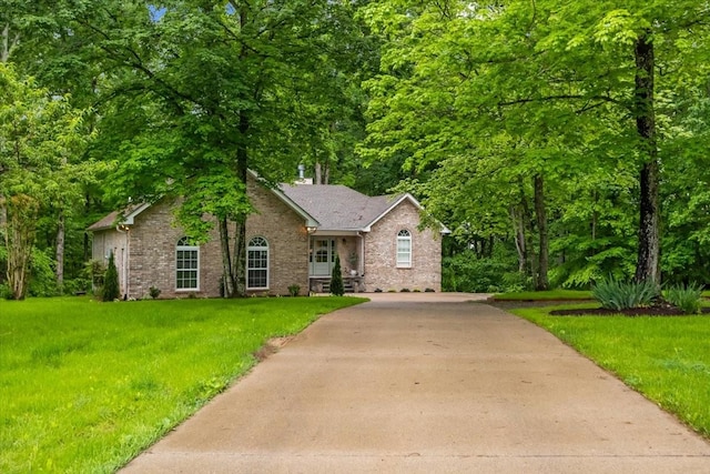 7327 Hunting Camp Rd, Fairview, TN 37062 - ranch-style house with driveway, brick siding, and a front yard