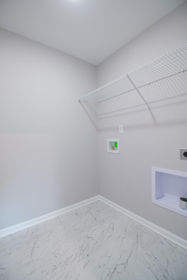 clothes washing area featuring washer hookup, laundry area, marble finish floor, baseboards, and electric dryer hookup