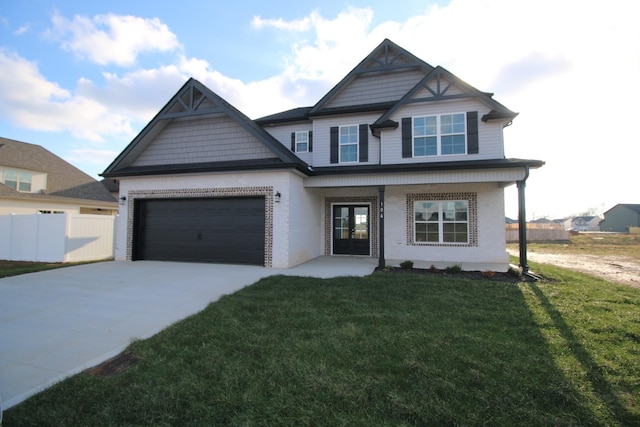 view of front of home featuring driveway, french doors, a front yard, a garage, and brick siding