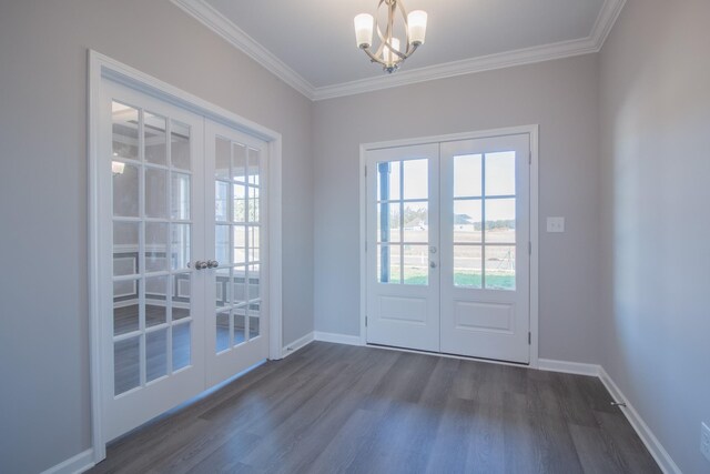 doorway featuring french doors, ornamental molding, dark wood-style flooring, and baseboards