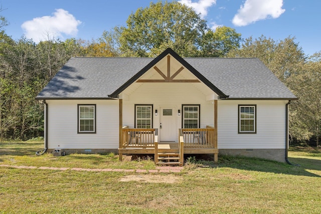 view of front of property with a deck, a shingled roof, a front yard, and crawl space