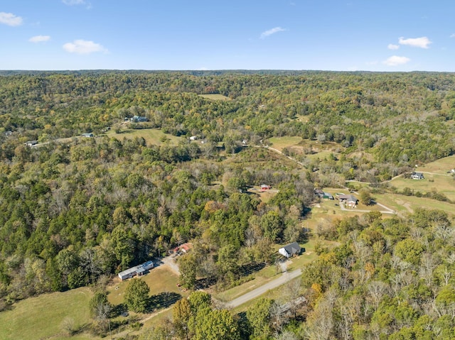 aerial view featuring a wooded view