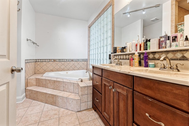 full bathroom featuring a bath, tile patterned flooring, a sink, and double vanity