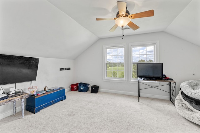 interior space with lofted ceiling, carpet, ceiling fan, and baseboards