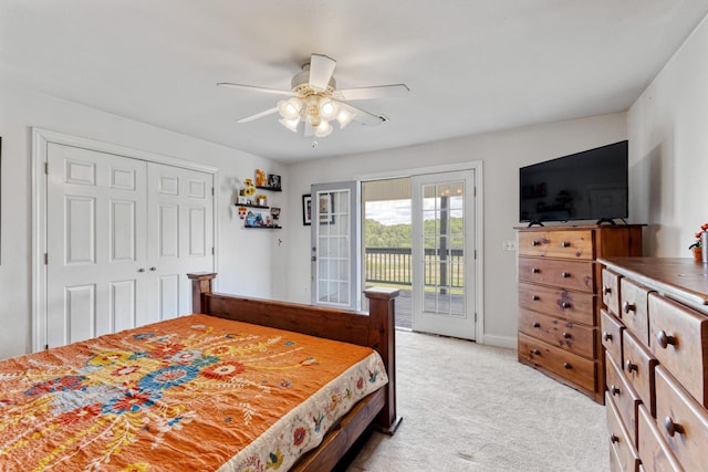 bedroom with a closet, ceiling fan, access to outside, and light colored carpet