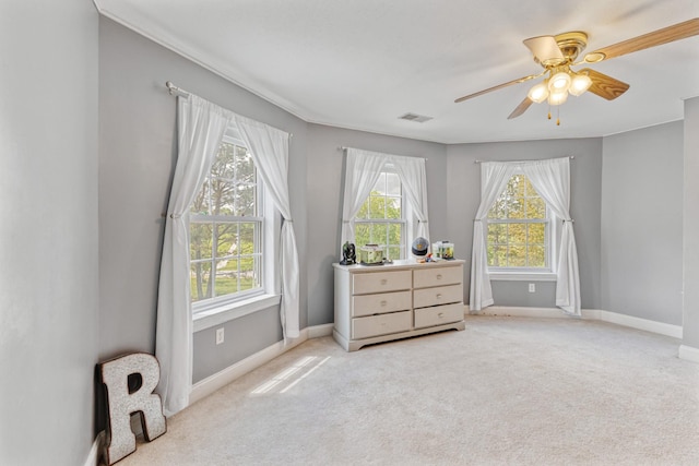 bedroom with baseboards, visible vents, multiple windows, and carpet