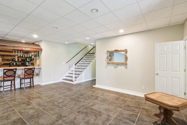 4025 Moore Hollow Rd, Woodlawn, TN 37191 - interior space with a paneled ceiling, stairs, tile patterned flooring, and a dry bar