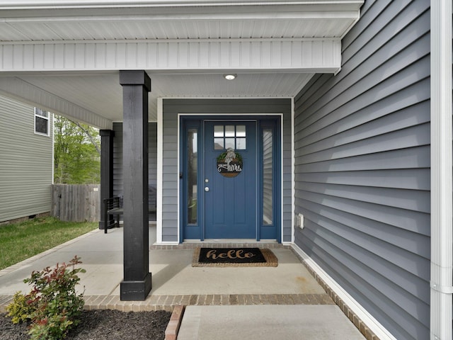 doorway to property with fence