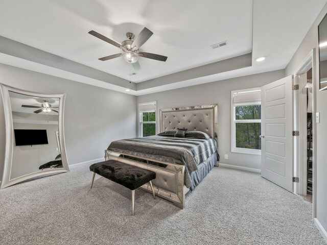 carpeted bedroom featuring recessed lighting, a ceiling fan, visible vents, and baseboards