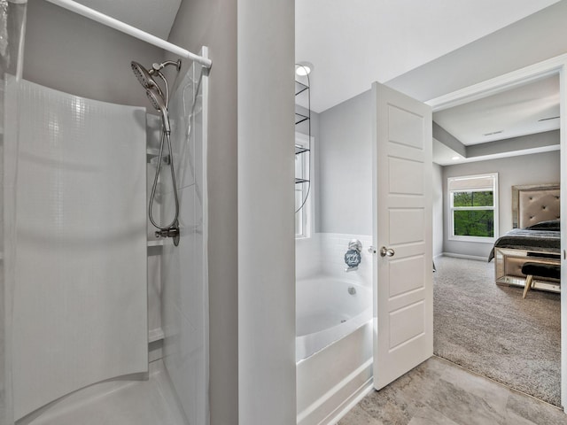 bathroom featuring a garden tub and a shower