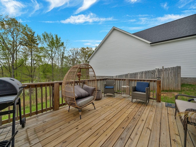 wooden terrace featuring grilling area