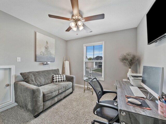 office space featuring ceiling fan, carpet floors, and baseboards
