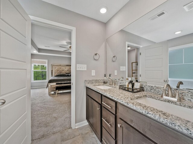 full bath featuring a sink, ceiling fan, and visible vents