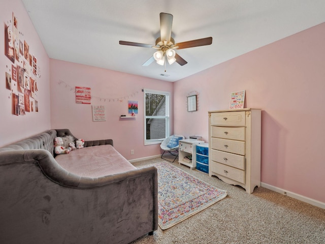 bedroom with light colored carpet, visible vents, a ceiling fan, and baseboards