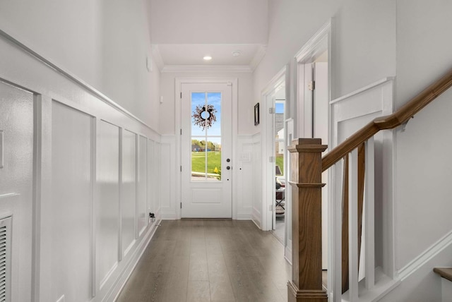 4372 Spregan Way, Smyrna, TN 37167 - foyer with crown molding, dark wood-type flooring, a decorative wall, wainscoting, and stairs