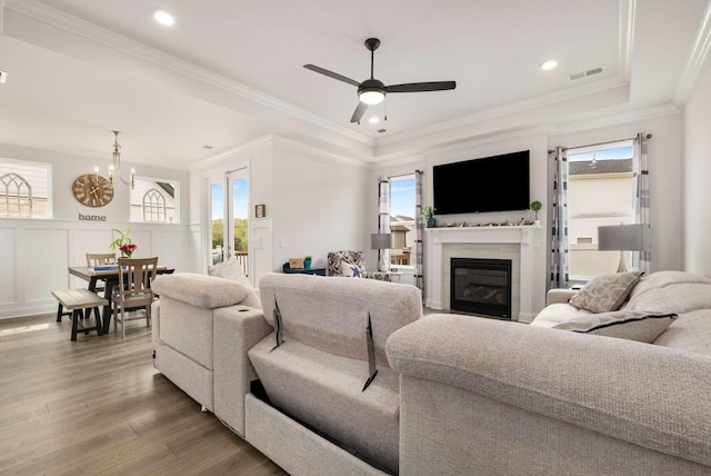 4372 Spregan Way, Smyrna, TN 37167 - living area featuring plenty of natural light, visible vents, wood finished floors, and a glass covered fireplace