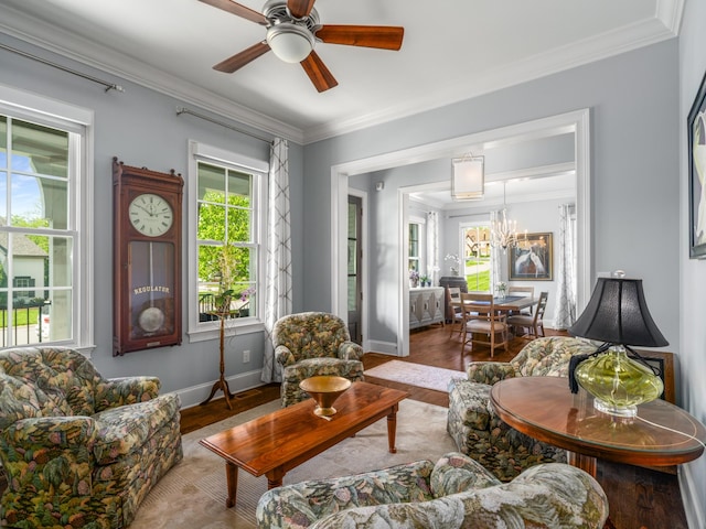 1504 Registry Row, Arrington, TN 37014 - living area featuring crown molding, baseboards, ceiling fan with notable chandelier, and wood finished floors