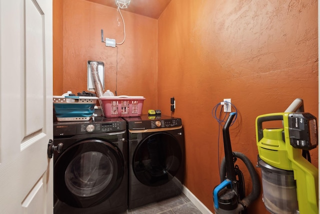 laundry area with washer and clothes dryer and laundry area