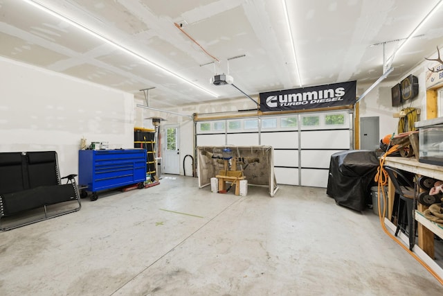 garage featuring a garage door opener and electric panel