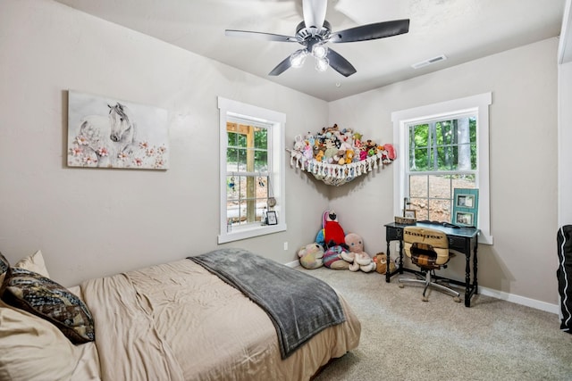 2217 Wiley Pardue Rd, Ashland City, TN 37015 - carpeted bedroom with multiple windows and a ceiling fan