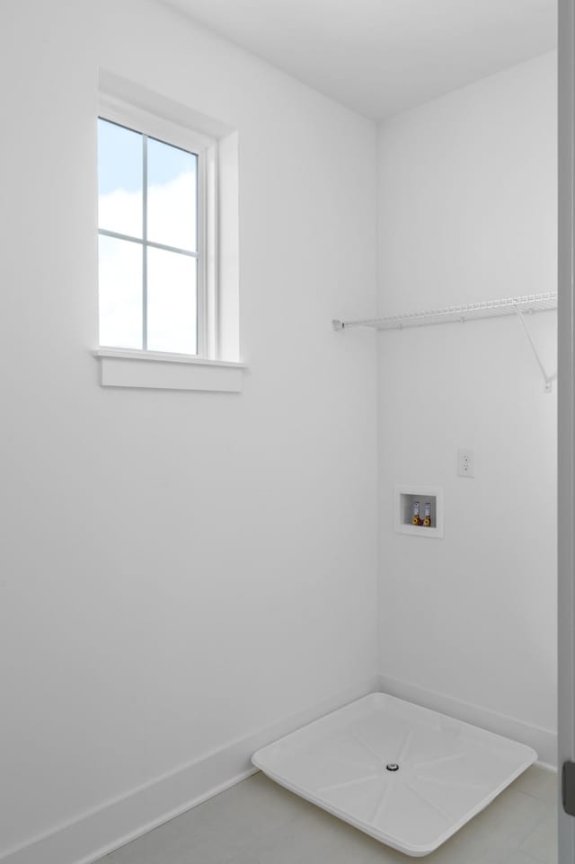 laundry room featuring washer hookup, laundry area, and baseboards
