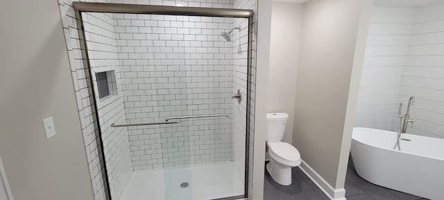 full bathroom featuring baseboards, a shower stall, and toilet