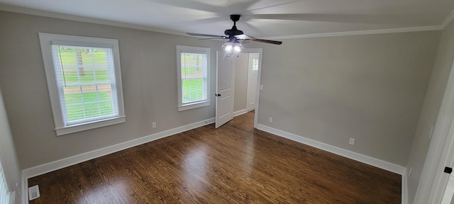 empty room with dark wood-style floors, ceiling fan, and crown molding