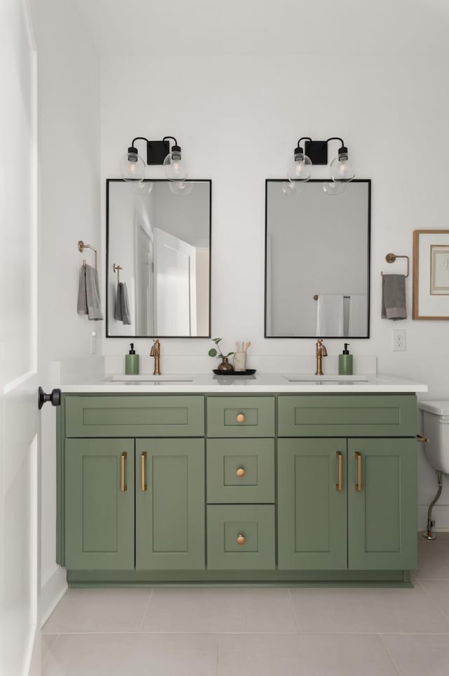 full bathroom with tile patterned floors, double vanity, and a sink
