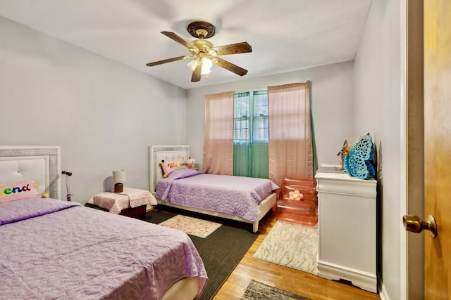 bedroom with wood finished floors and ceiling fan