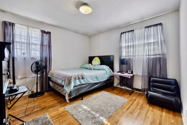 bedroom featuring wood finished floors