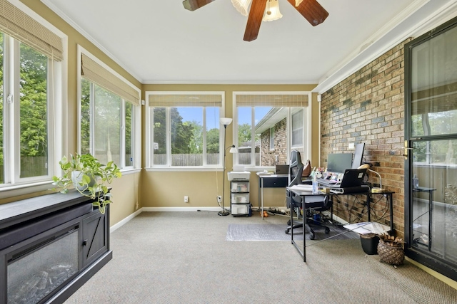 office space with ornamental molding, a ceiling fan, baseboards, and carpet floors