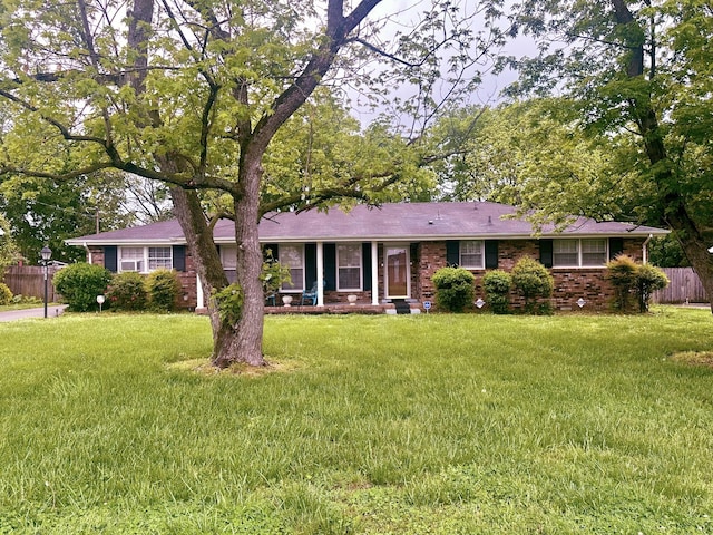 ranch-style home with brick siding and a porch