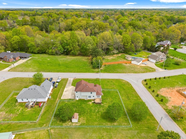 2938 Heatherfield Dr, Woodlawn, TN 37191 - aerial perspective of suburban area with a heavily wooded area