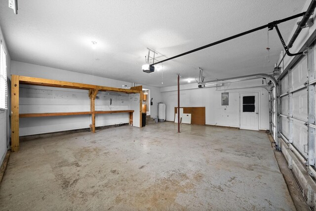 2938 Heatherfield Dr, Woodlawn, TN 37191 - garage with a garage door opener, electric panel, and water heater