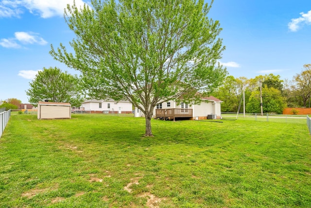 2938 Heatherfield Dr, Woodlawn, TN 37191 - view of yard featuring a wooden deck, a storage unit, an outbuilding, and cooling unit