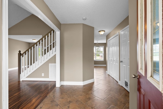 2938 Heatherfield Dr, Woodlawn, TN 37191 - foyer entrance featuring baseboards, a textured ceiling, and stairs