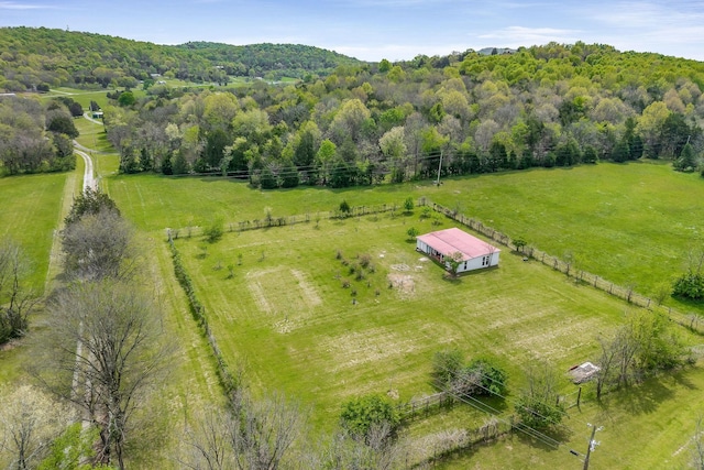 aerial view featuring a rural view and a view of trees