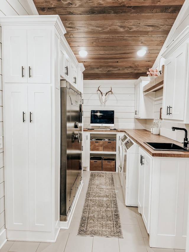 233 Garner Ln, Lawrenceburg, TN 38464 - kitchen with washing machine and dryer, refrigerator, a sink, and wood ceiling